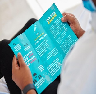 covid-brochure-person-reading-information-virus-safety-security-protection-healthcare-advice-patient-with-knowledge-vaccination-document-from-clinic-with-instructions_590464-135743