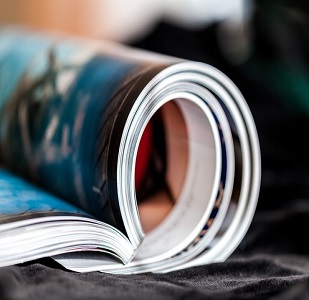 rolled-up-magazines-with-reflection-background_488220-3566